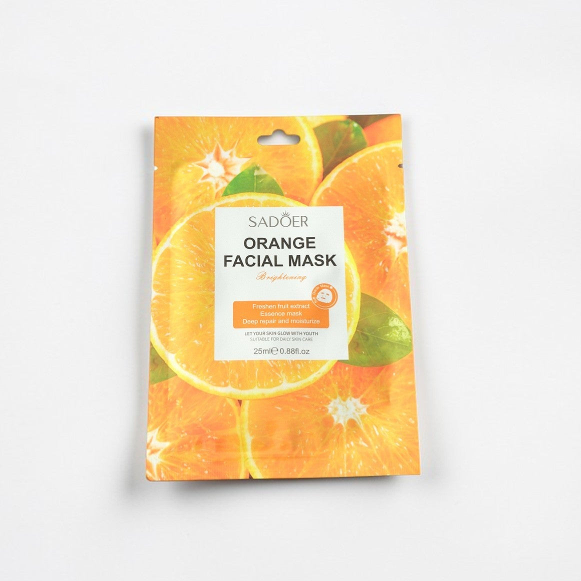Orange facial mask packaging on a white background