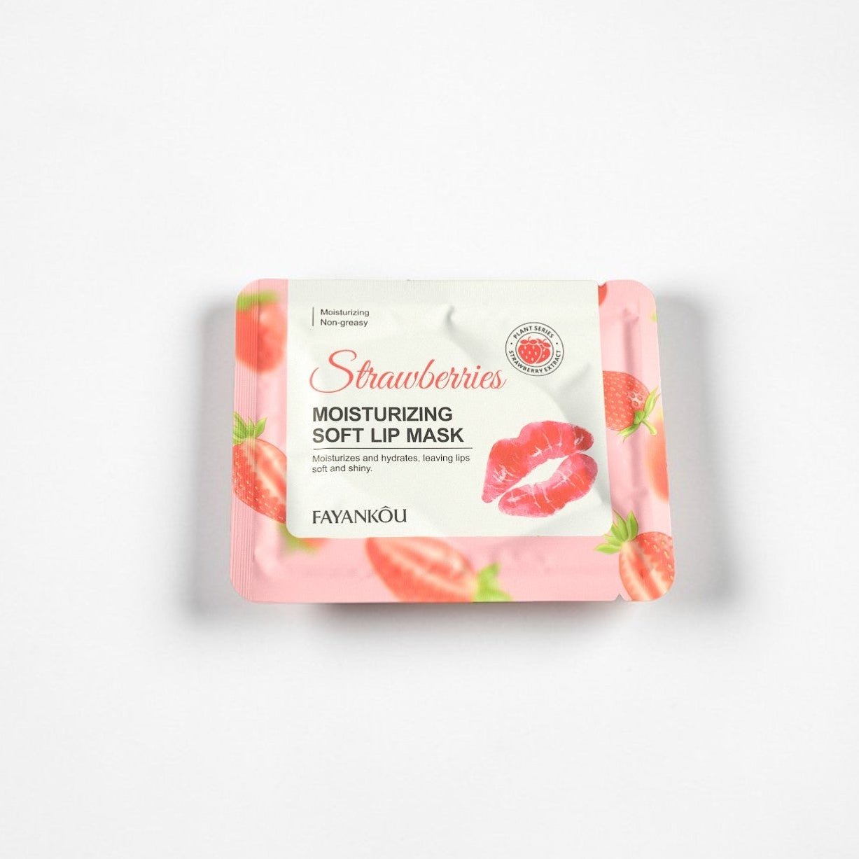 Packaging of a strawberry-flavored soft lip mask on a white background